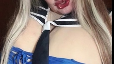 Susi is wearing a sailor outfit sucking giving a toy blowjob