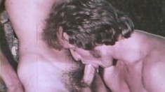 Lusty gay stud gets on all fours to swallow a cock in this vintage video